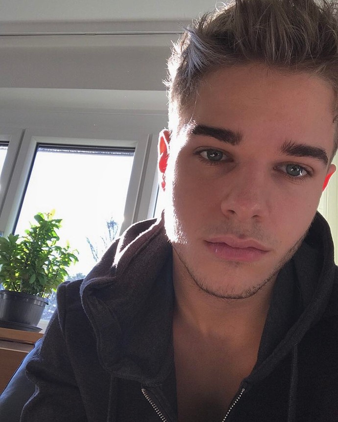 Is this blond-haired and blue-eyed boy handsome?