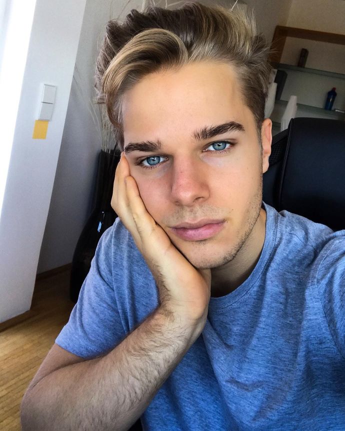 Is this blond-haired and blue-eyed boy handsome?
