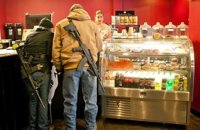 Should open carry be illegal (not in terms of having your gun on your side showing it) but rather you cant hold a gun in your hands pubically?