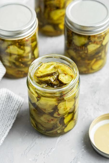 Sliced pickles in jar