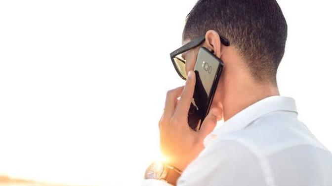 Why would guy act super weird when on the phone with his girlfriend?