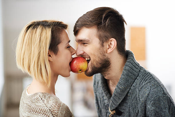A happy solution, there are two people sharing an apple, how can it be done so both people are content?