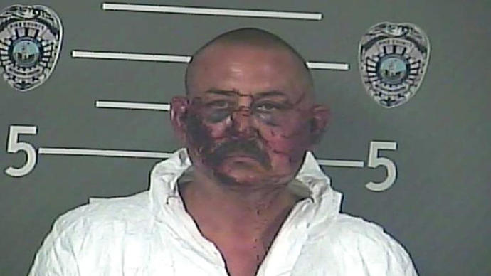 How come cop killers mug shots always look like this?