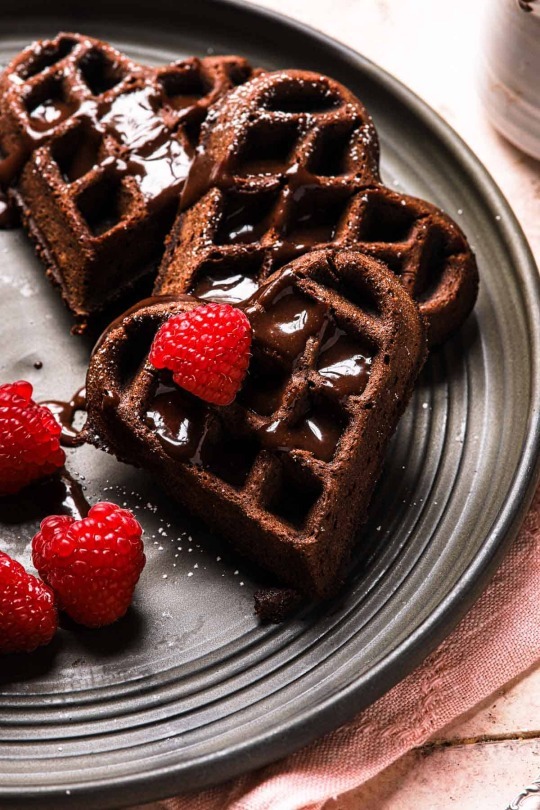Chocolate waffles with raspberries and choco drizzle