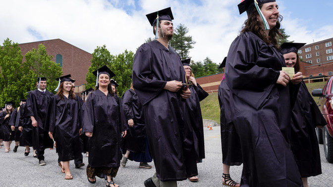 Did you graduate on stage, or did you skip the graduation ceremony?