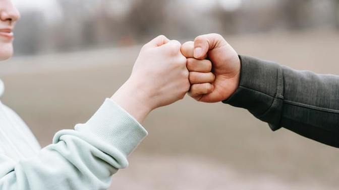 Why would a guy fist bump a girl?