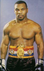 How is built stronger and massive who has a look of a champion, Brock Lesnar or Mike Tyson?
