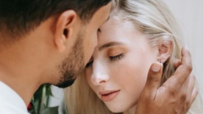 What does it mean when a guy brushes your hair out of your face?