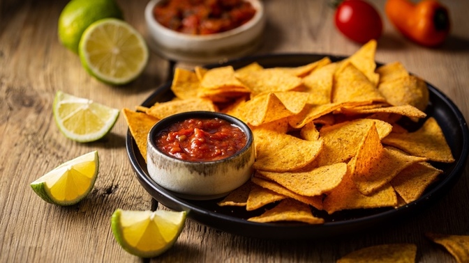 Why do mexican restaurants serve or give free chips and salsa?