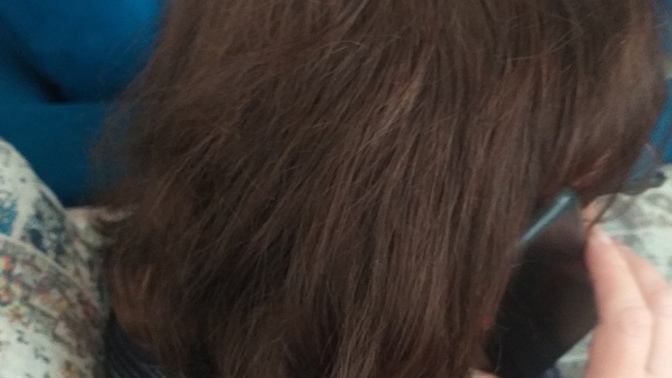 I know it is such a weird question to ask, but we bleached and dyed my mum's hair to light brown. Does it look slightly red to you?