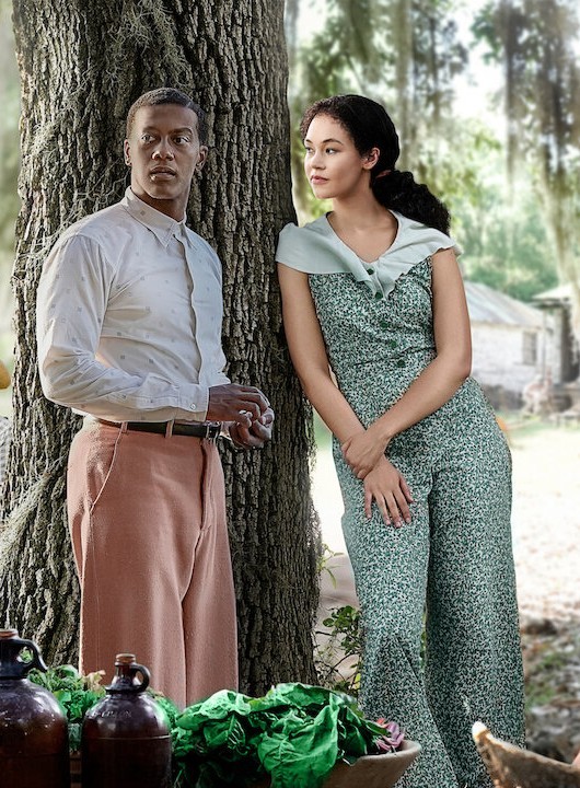 Does this lady standing next to this black guy look white?