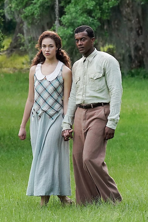 Does this lady standing next to this black guy look white?