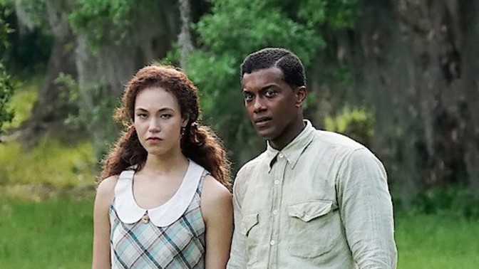 Does this lady standing next to this black guy look white?