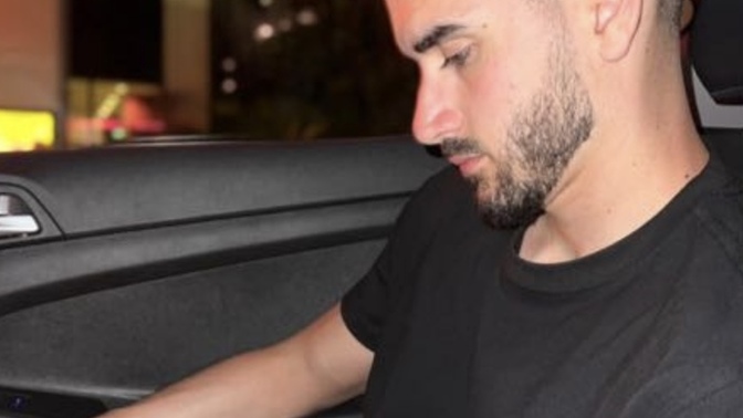 Is this man wearing a Rolex?