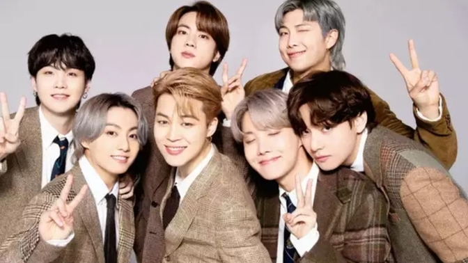 Are women who crush on BTS bisexuals since they have feminine features?