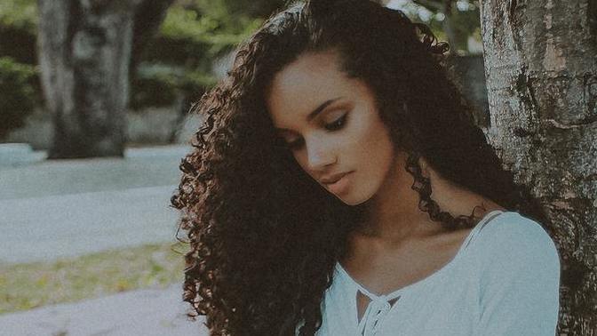 Conflict in long-distance relationship: Mom's visit exposes her racist views. Boyfriend's angry reaction and claim of no feelings. Seeking advice?