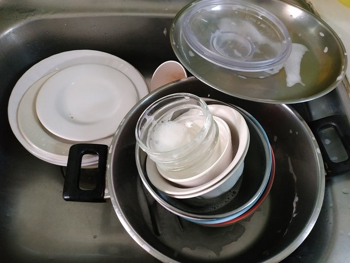Is it okay for someone to allow dirty dishes to stack up that they dirtied themselves while sharing a living space with others?