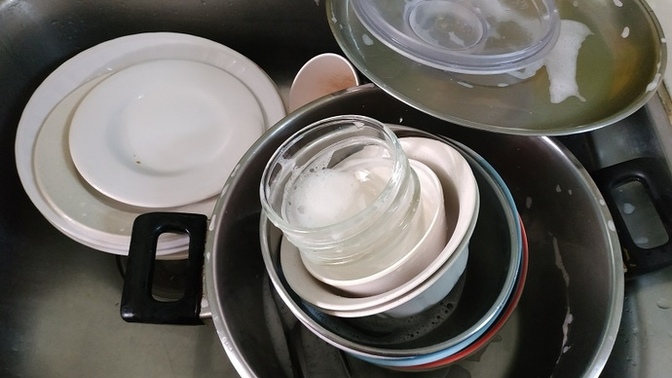 Is it okay for someone to allow dirty dishes to stack up that they dirtied themselves while sharing a living space with others?