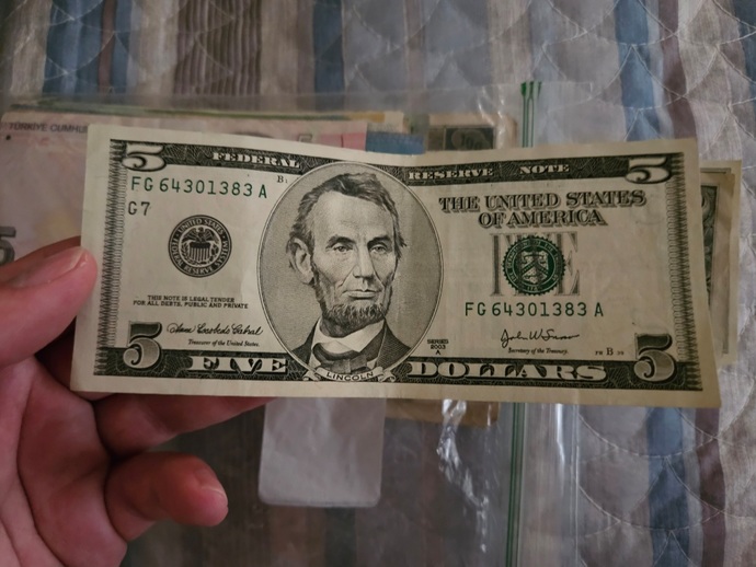 Is this $5 bill counterfeit? Whys it so white?