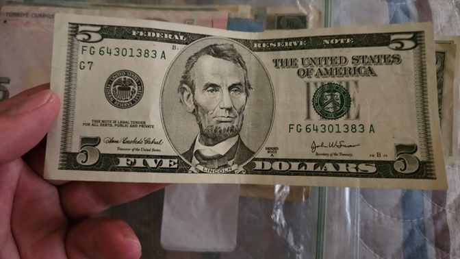 Is this $5 bill counterfeit? Why's it so white?