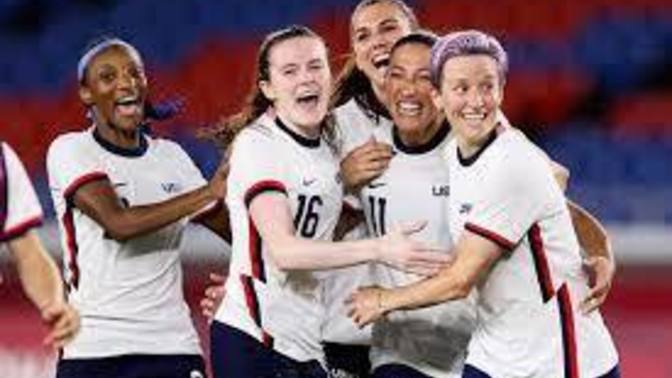 Why didn't the American woman's football team sing the national anthem?