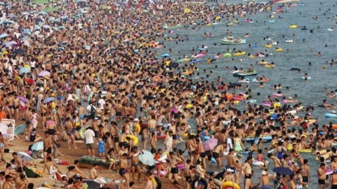 What is the attraction of a crowded beach?