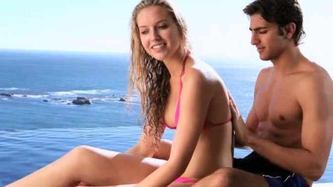 Is it appropriate to put sunscreen on another man’s wife?
