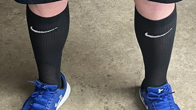 Why do high school students wear their Nike Elite socks up high to their calves when they wear shorts to their knees?