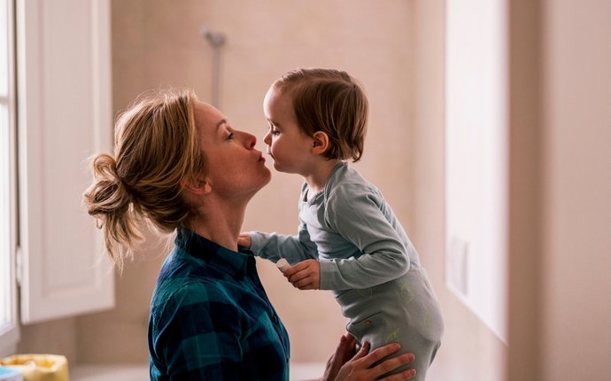 How much does a woman value decreases in the dating game once she has a child?