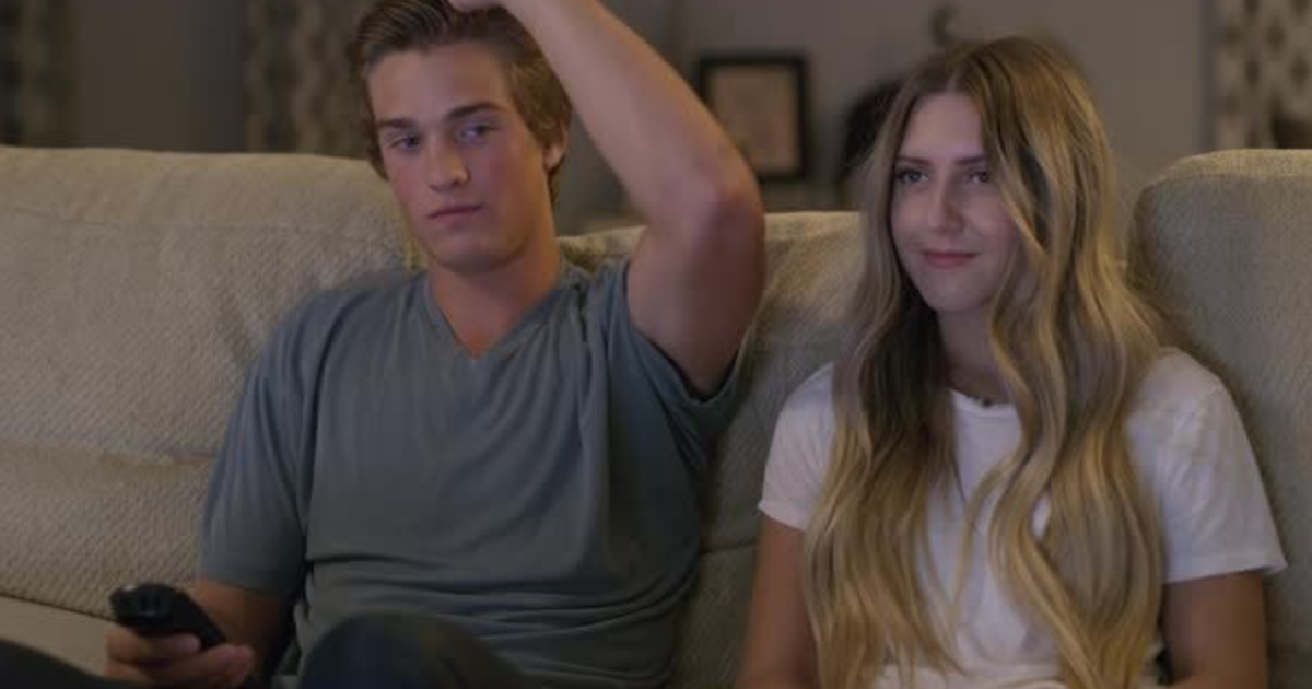 What does it mean when a guy wraps his arm around a girl's shoulder