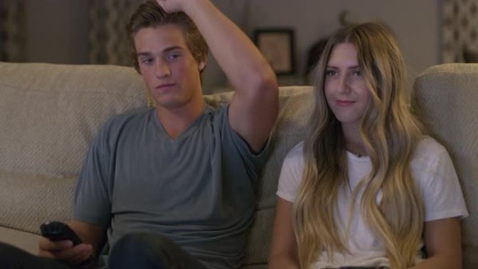 What does it mean when a guy wraps his arm around a girl's shoulder?