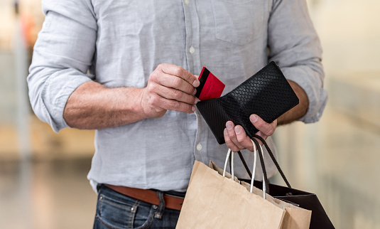 Girls, does your guy ever ask you to carry his stuff in you handbag?