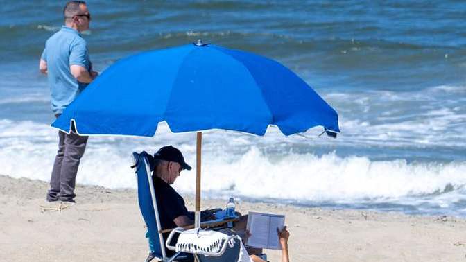 What type of person can just sit on the beach knowing he was responsible for leaving American families behind enemy lines in Afghanistan?