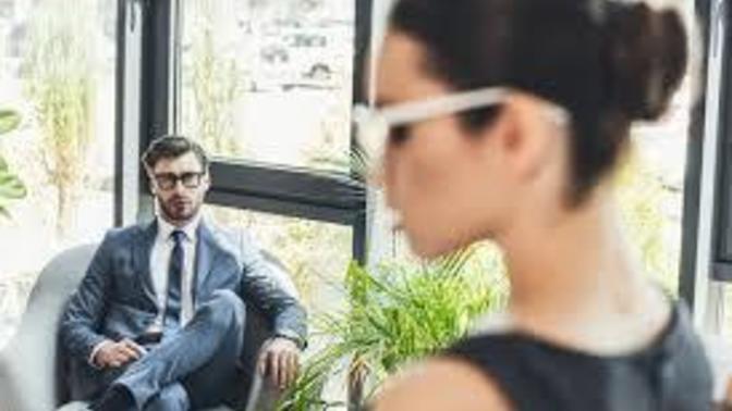 How do I deal with a guy from work who, whenever we have an office get-together, he follows me around and listens to my conversations?
