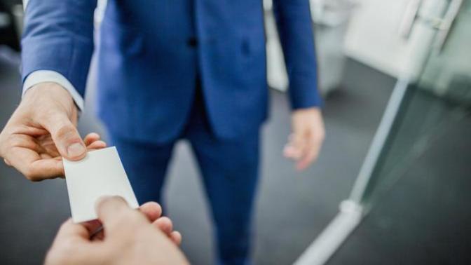 Should I give a business card to someone I want to date?