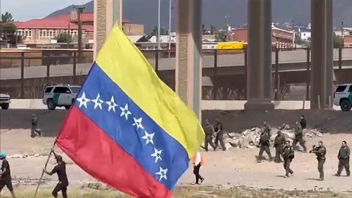 If Migrants flooding the US border are fleeing their country in fear for their lives, why are they flying THEIR countrys flag and NOT the USA Flag?