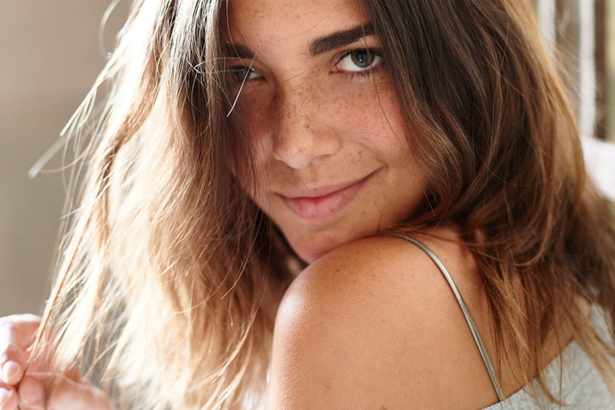Girl flirting via eye contact