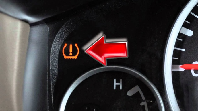 What do you do when your cars TIRE PRESSURE WARNING light comes on?