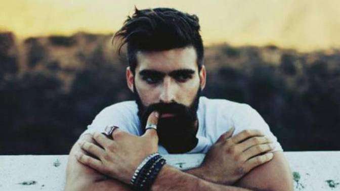 Why are men with dark hair more attractive to women?