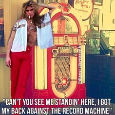 If you were single at a bar and saw someone standing with their back against the record machine, what would you think?