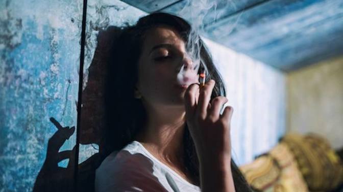 Guys, do you find a girl attractive if she smokes?