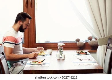 Is it out of the norm for women to eat by themselves at restaurants?