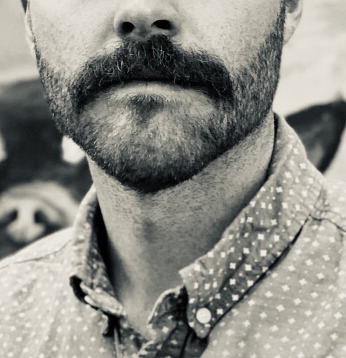 Does a moustache make you look more gay or masculine?