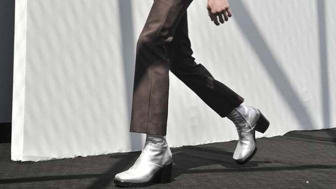 If women prefer/date tall/er men, then why aren't guys the ones wearing heels?