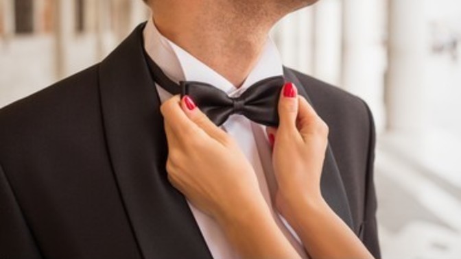 Why do some women like to fix men's clothes?