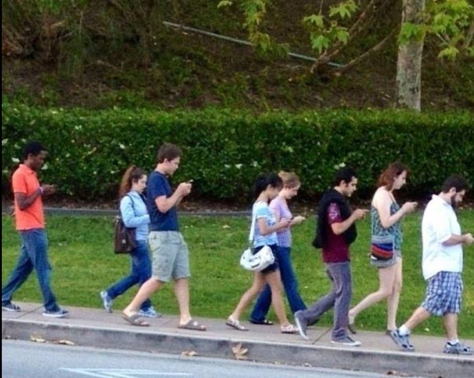 Why when I see or pass by my crush he is on phone?