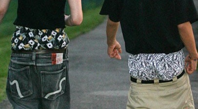 How should boys wear jeans?