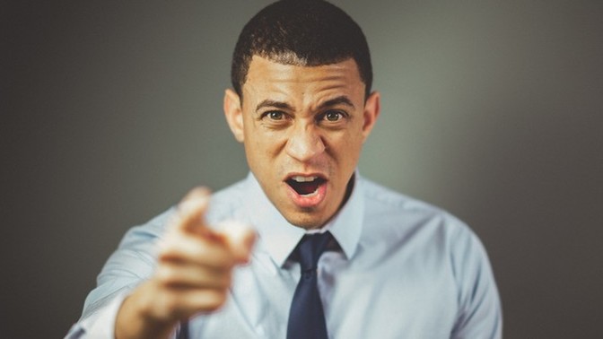 Could a guy's mean behavior towards a girl be motivated by seeking a reaction or attention, and would he stop being mean if she didn't react?