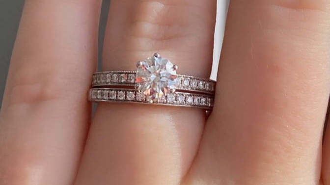 People who have been married: should a married woman wear both her engagement ring and wedding band after the wedding?