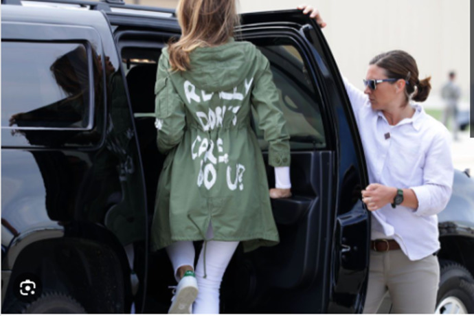 Guys, Which is the more likely meaning of Melanias jacket?